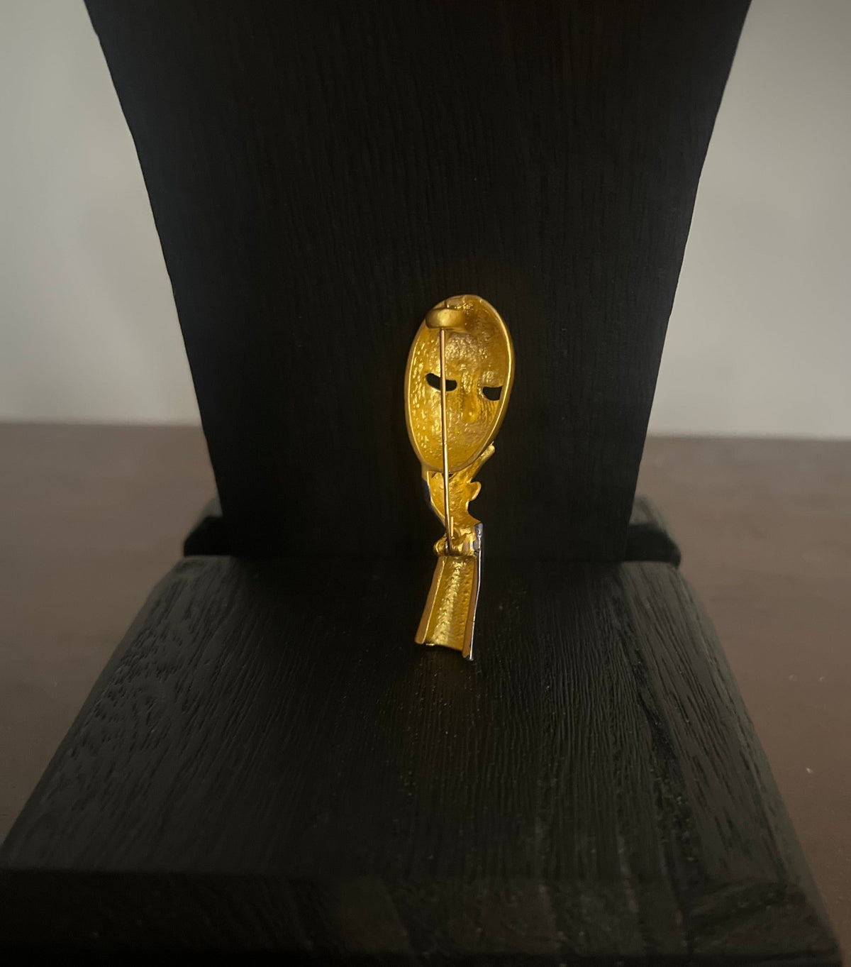 The Mysterious Mask Brooch